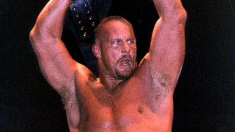 WWF Champion Stone Cold Steve Austin, holding his belt.