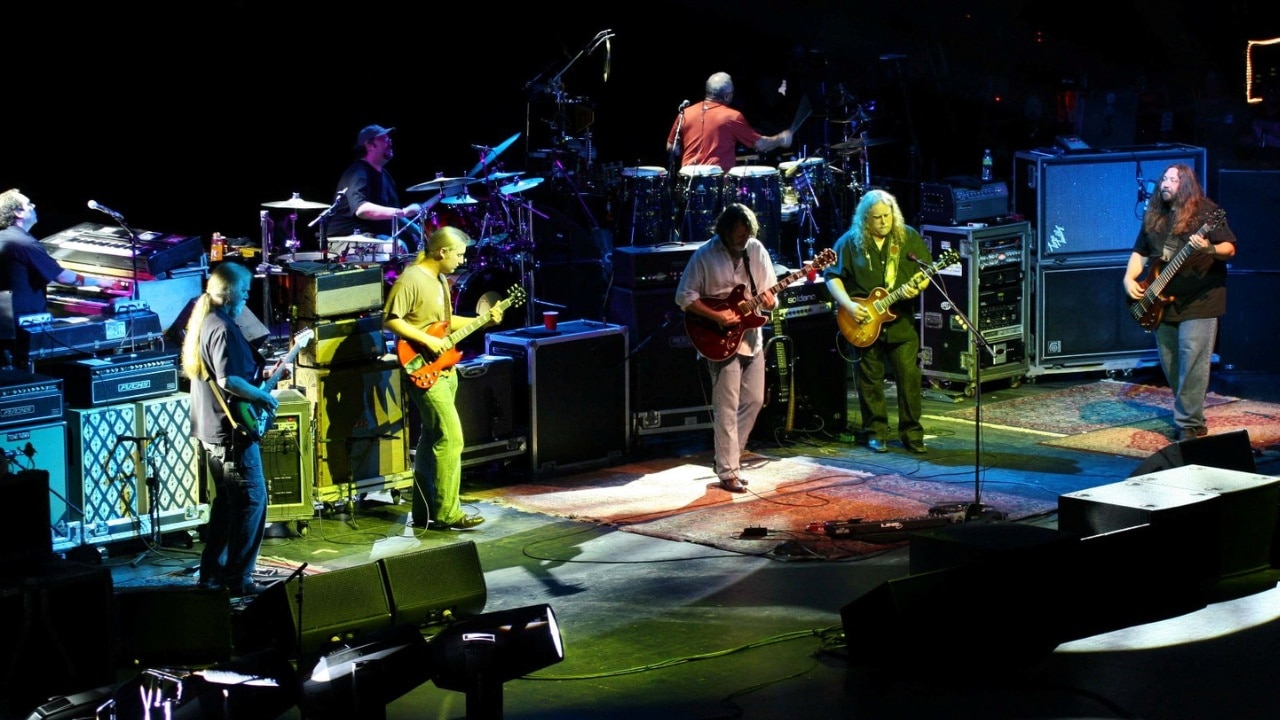 Members of The Allman Brothers perform onstage with Widespread Panic in Canandaigua, NY.