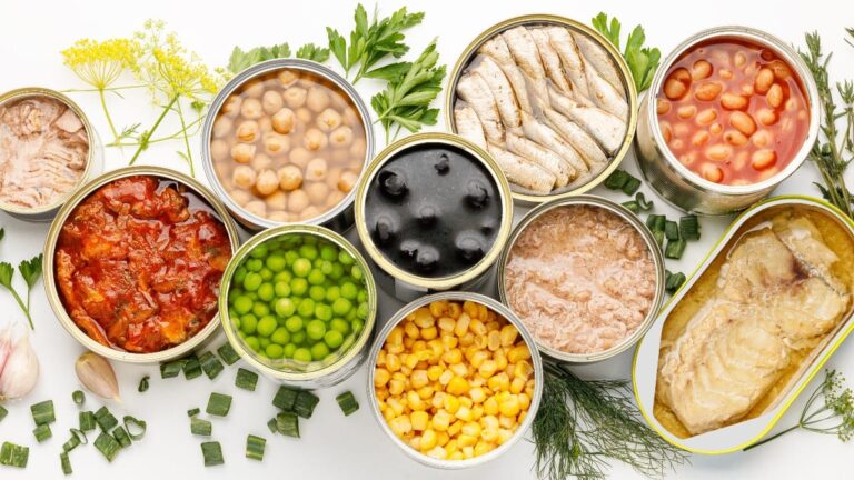 Various open cans of appetizing food