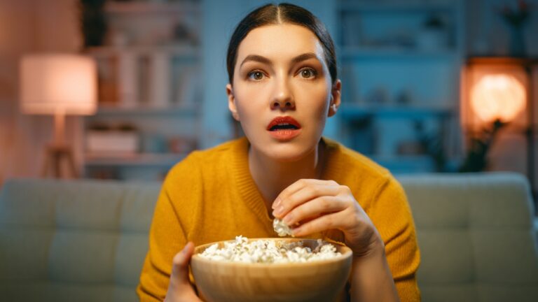 Watching TV, woman, movie, popcorn, surprise, shock fantasy book adaptations