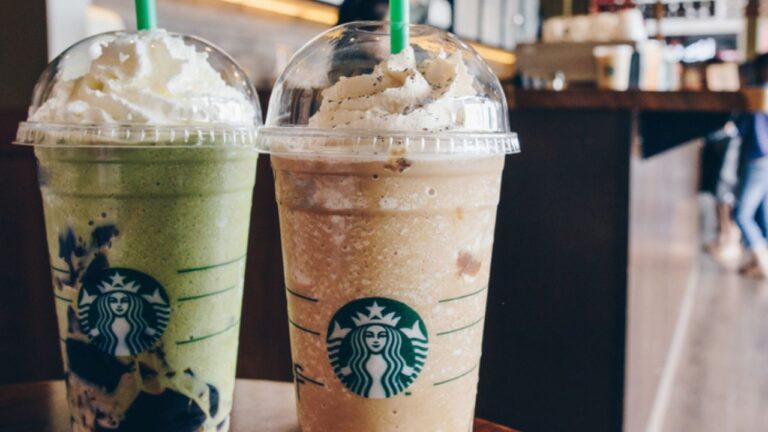 A Venti Starbucks frappuccino Irish coffee and Green tea latte frappuccino in Starbucks coffee shop. 669899482