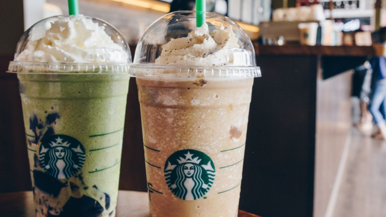A Venti Starbucks frappuccino Irish coffee and Green tea latte frappuccino in Starbucks coffee shop. 669899482