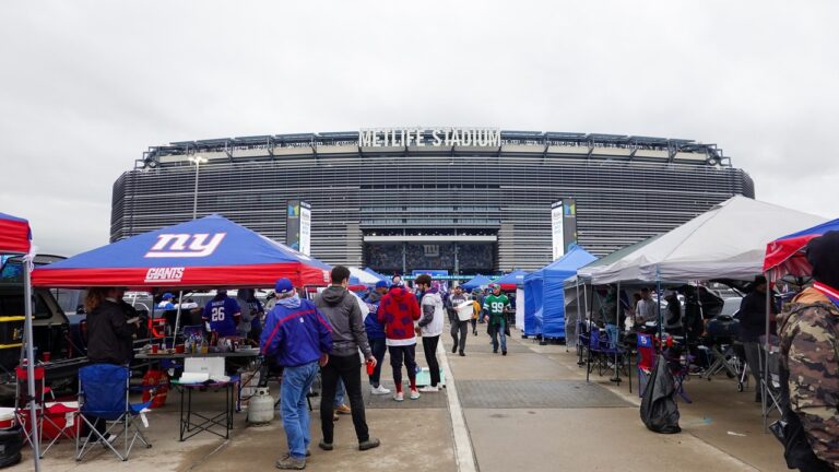Fans enjoy tailgating at MetLife Stadium before a football game.