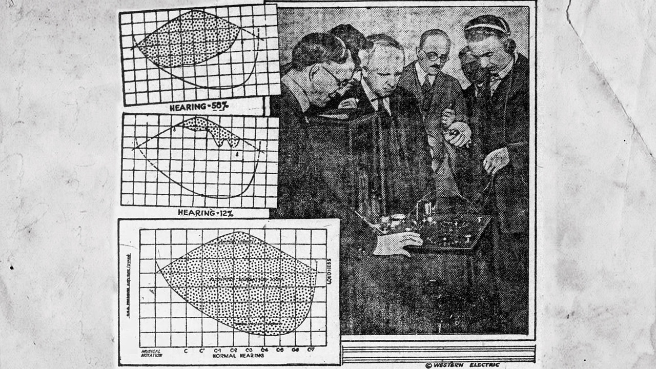 Ear specialists examine audiometer, 1923