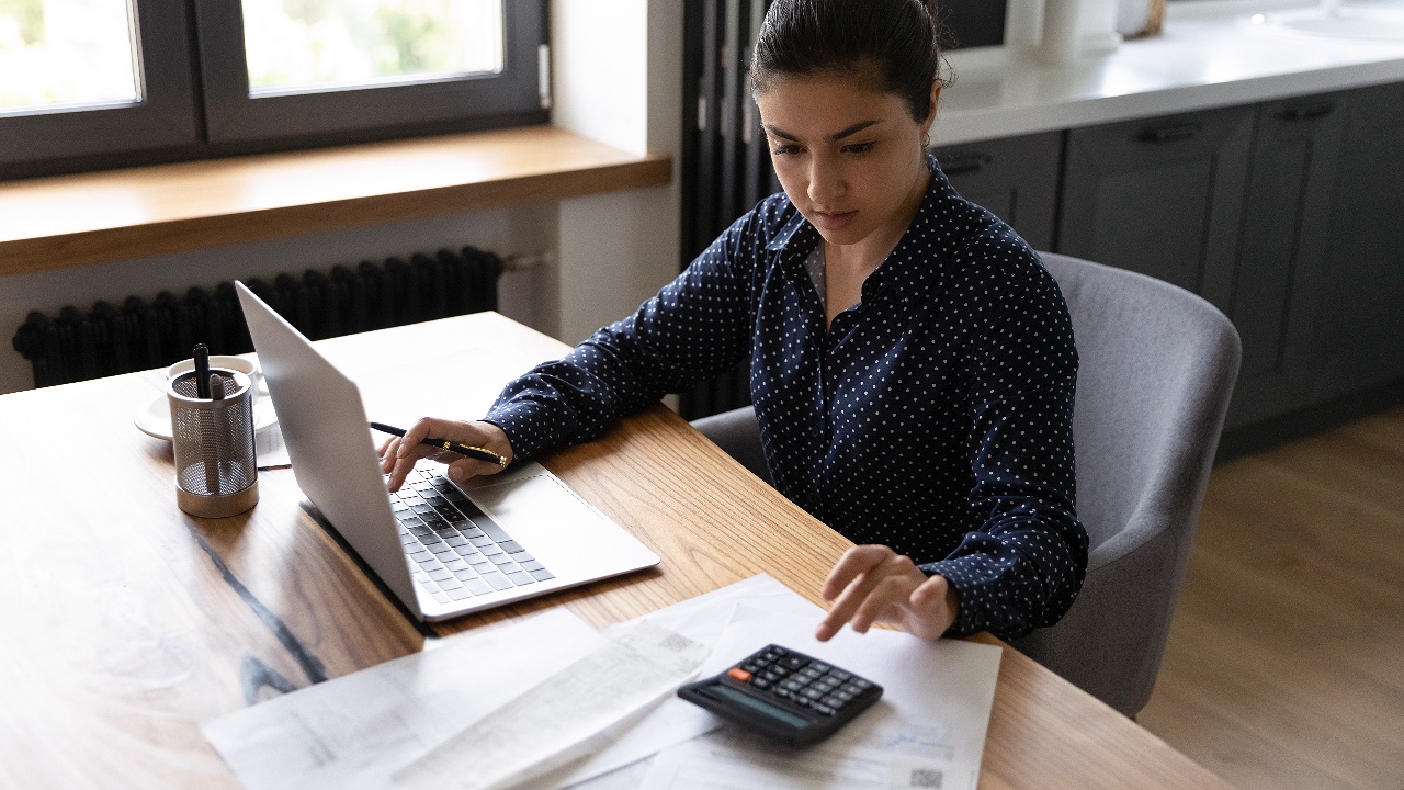 Busy woman professional accountant preparing annual financial report