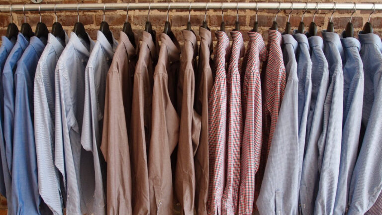 Button-up shirts hanging in a row