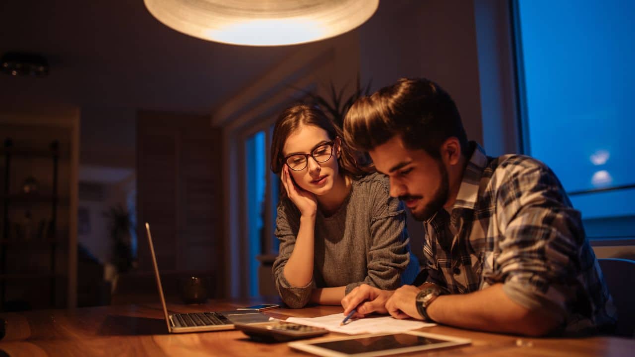 man and woman trying to work out finances