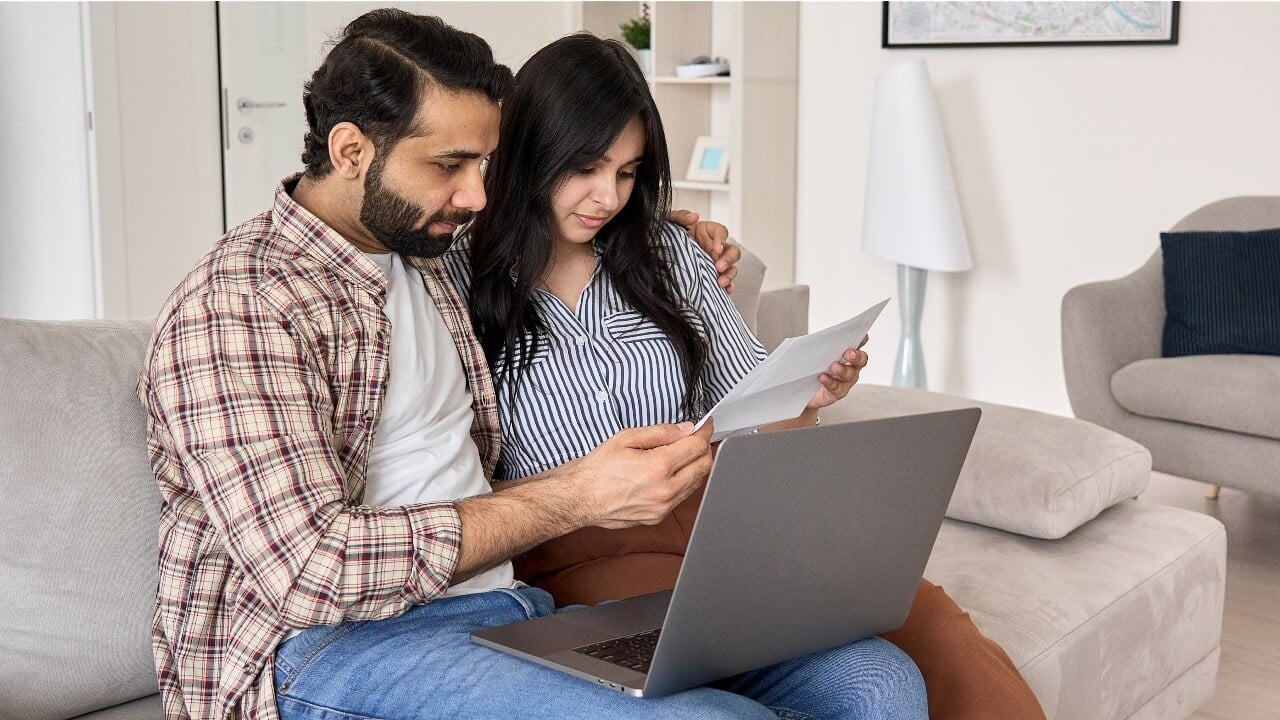 Couple using laptop, man, woman
