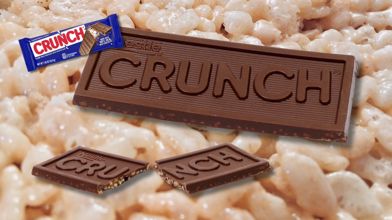 Crunch bar, broken and unbroken, with packaged candy near it and rice crispie cereal.