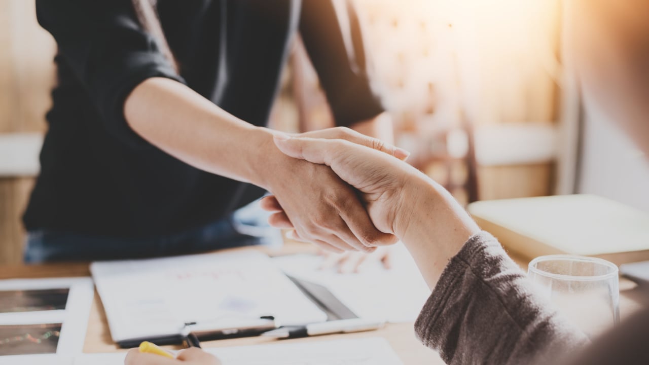 two hands shaking for a deal, negotiate, negotiation