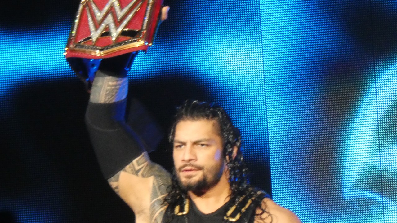 Professional wrestler Roman Reigns with the WWE Universal Championship