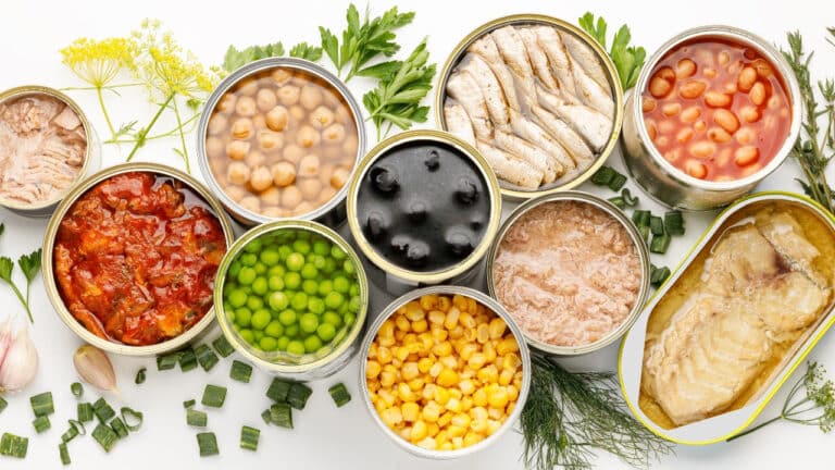 Various open cans of appetizing food