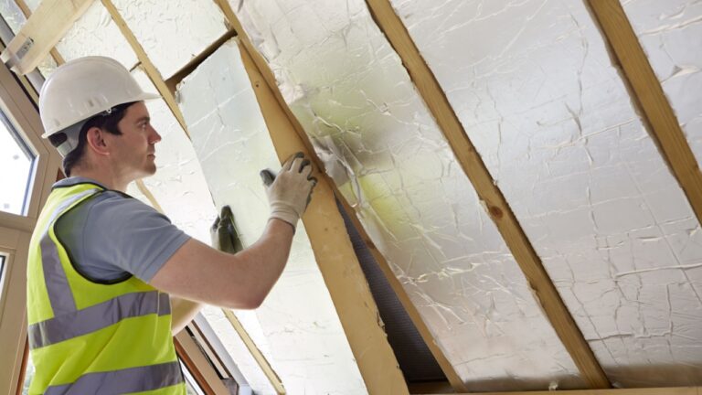 man working on roof at home