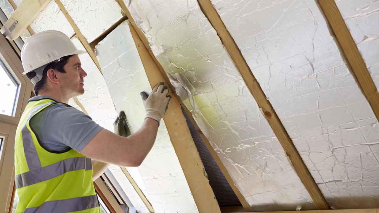 man working on roof at home