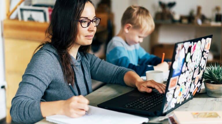 mom working from home next to child