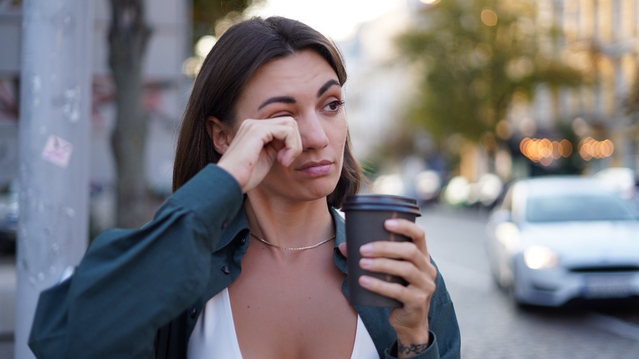tired woman drinking coffee