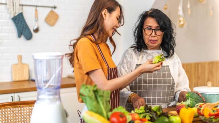 two women cooking at home