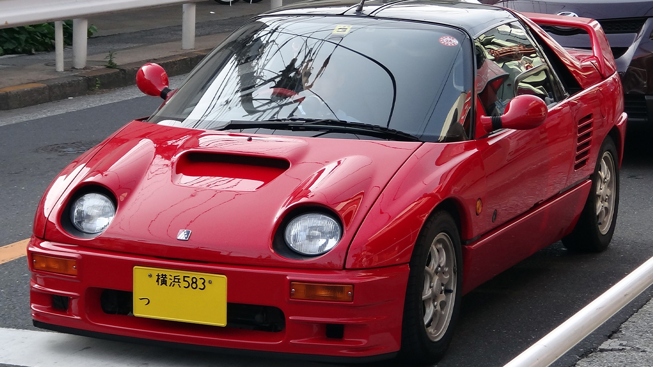 Autozam AZ-1, front 3/4 view, red exterior, on the road