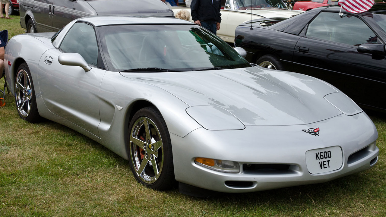 Chevrolet Corvette C5, front 3/4 view, silver exterior, car show