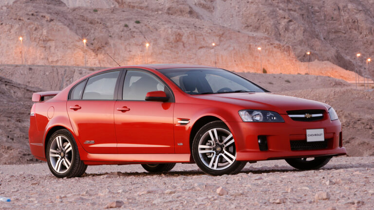 Chevrolet Lumina SS, front 3/4 view, red exterior, desert