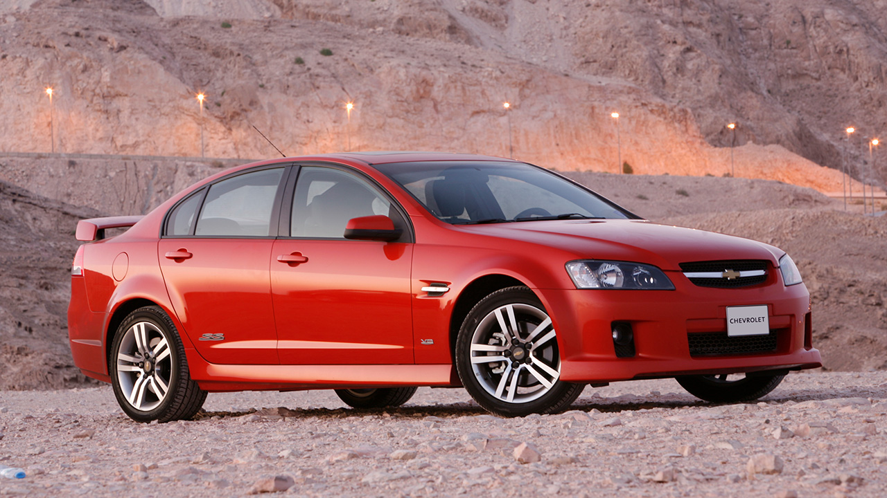 Chevrolet Lumina SS, front 3/4 view, red exterior, desert