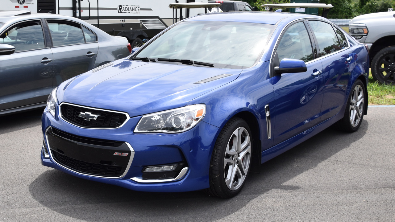 Chevrolet SS, front 3/4 view, blue exterior, five spoke wheels.