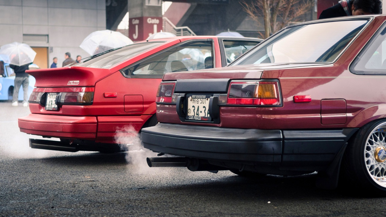 The rear of two drift vehicles at JCCA New Year Meet / Classic Car Festival - Fuji Speedway.