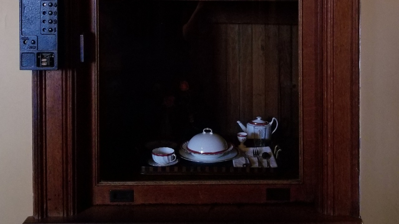 A dumbwaiter in the china pantry, with a tray of tableware placed inside, leads to the upper stories of Biltmore House, on Biltmore Estate in Asheville, North Carolina.