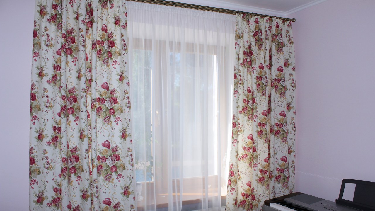 Floral print curtains and sheer drapes. 