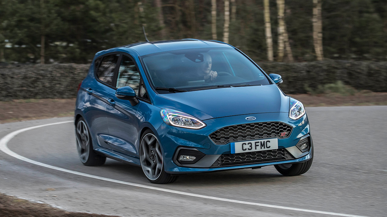 Ford Fiesta ST, blue, front 3/4 view, cornering