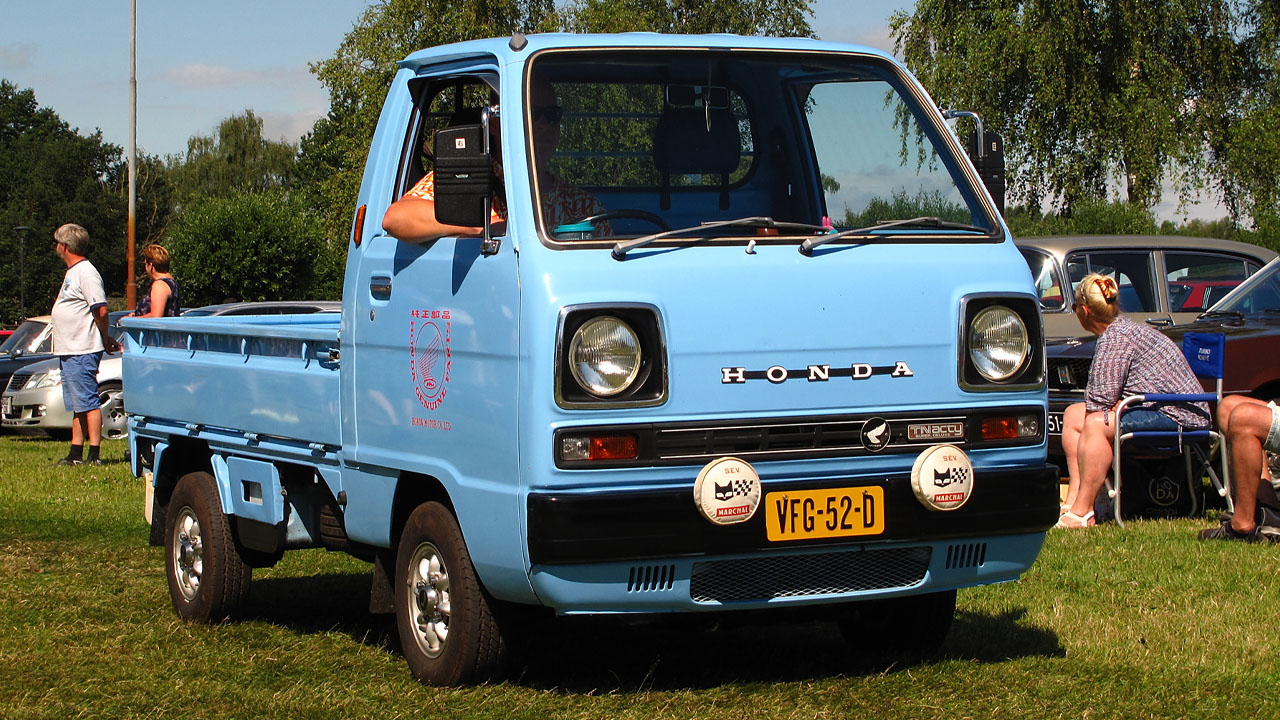 Modified Honda Acty Truck, front 3/4 view, light blue exterior, car show