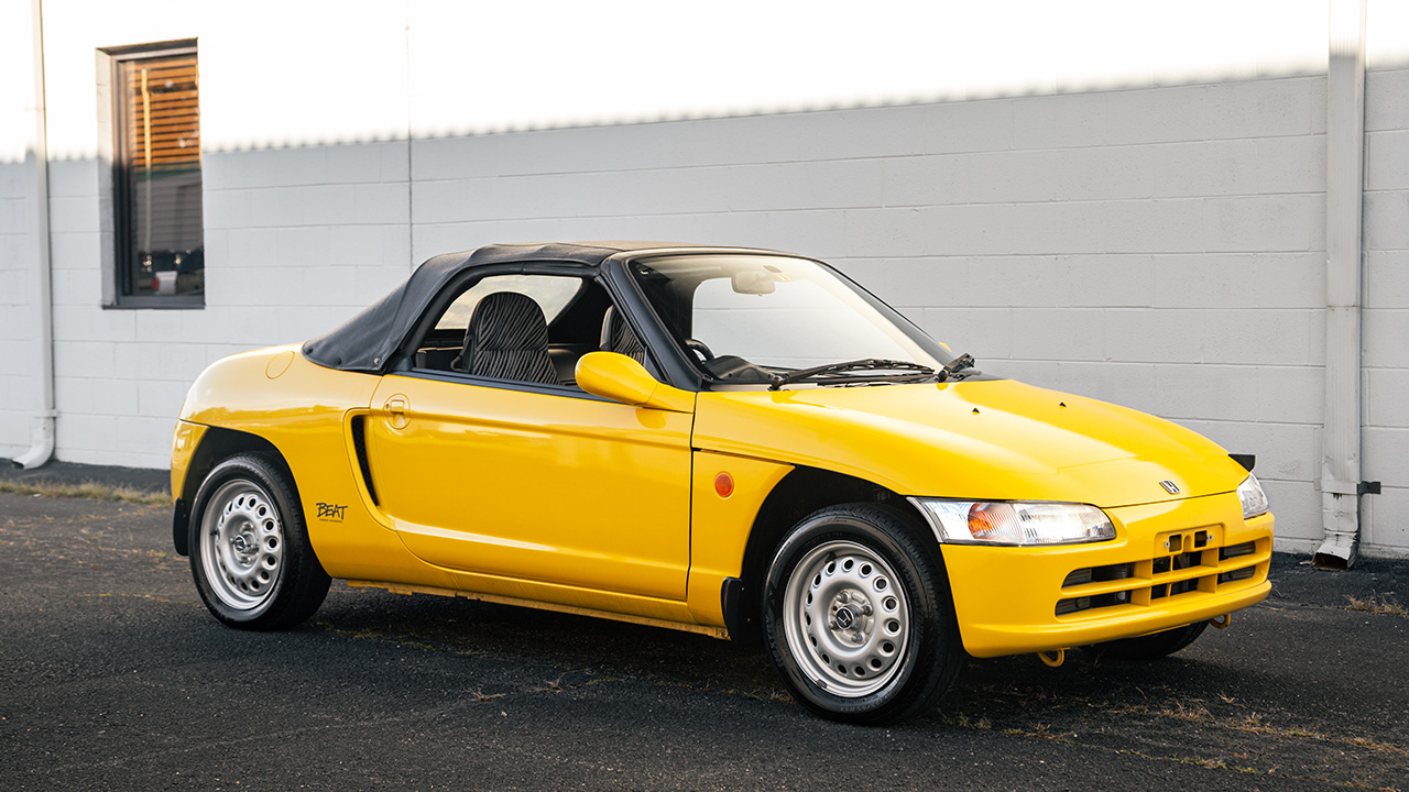 Honda Beat, front 3/4 view, roof up, yellow exterior, steel wheels