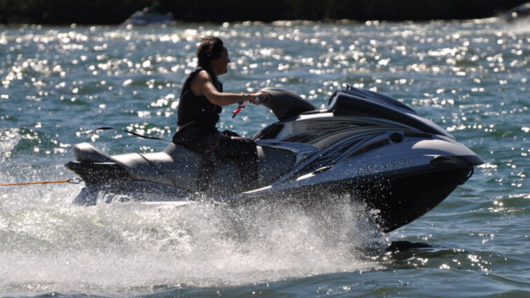 A person rides a jet ski