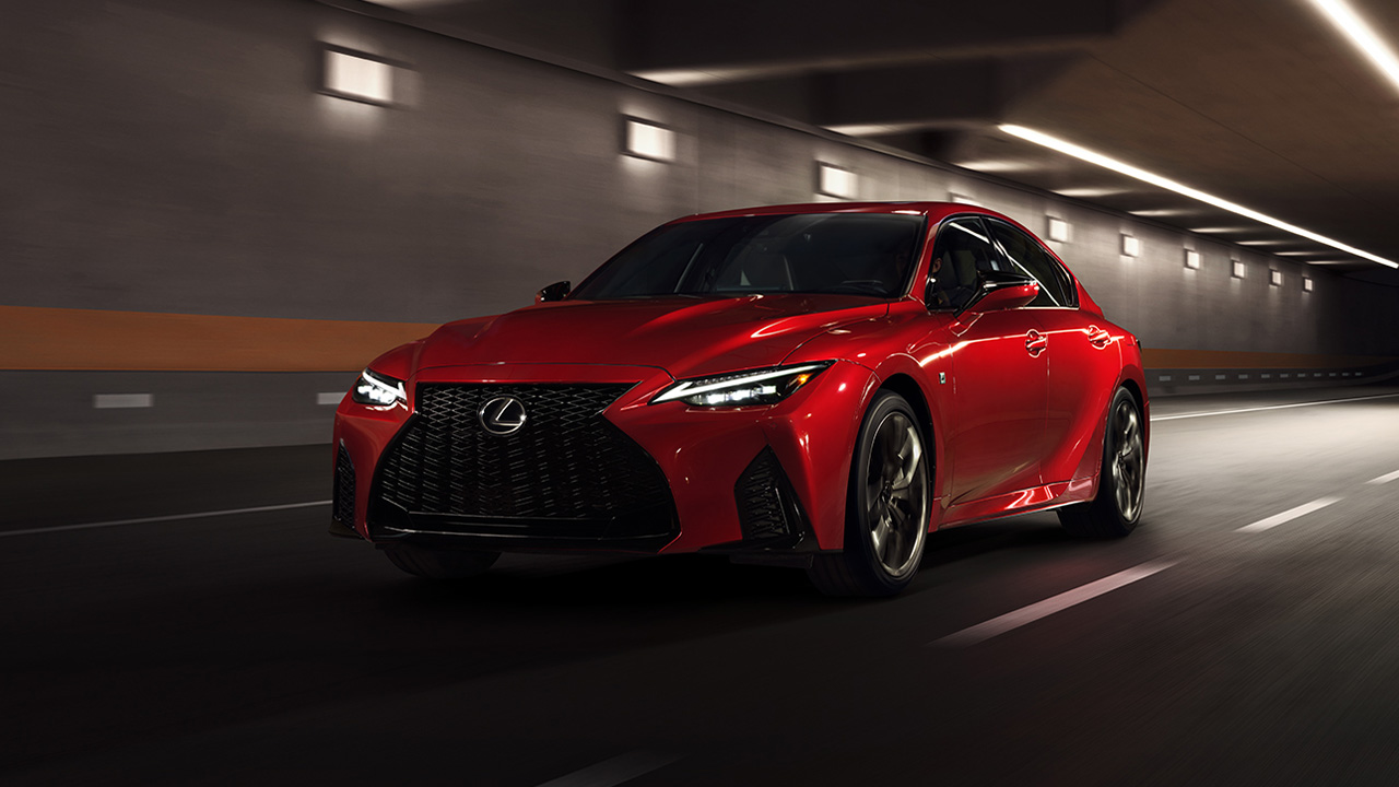 Lexus IS500, front 3/4 view, tunnel, driving, red exterior