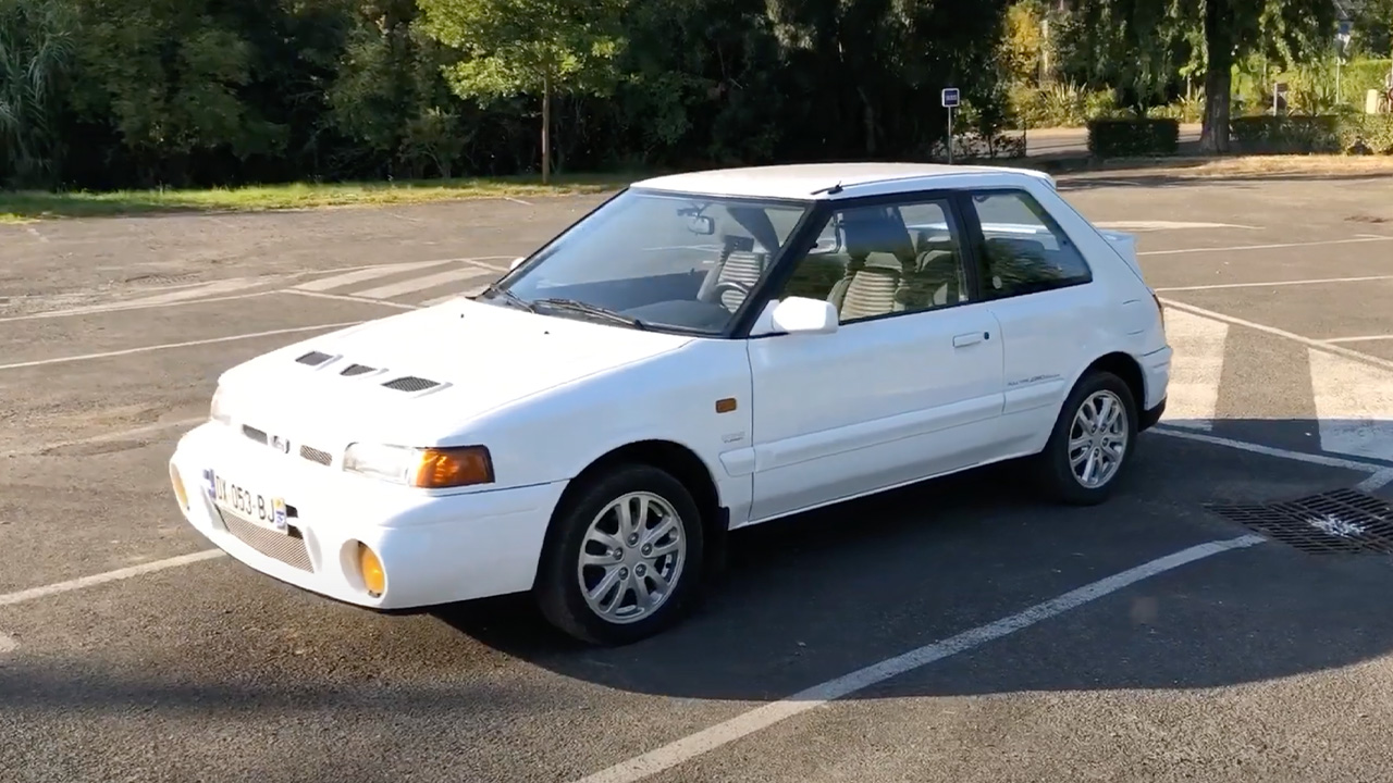 Mazda 323 GTR, front 3/4 view, white exterior