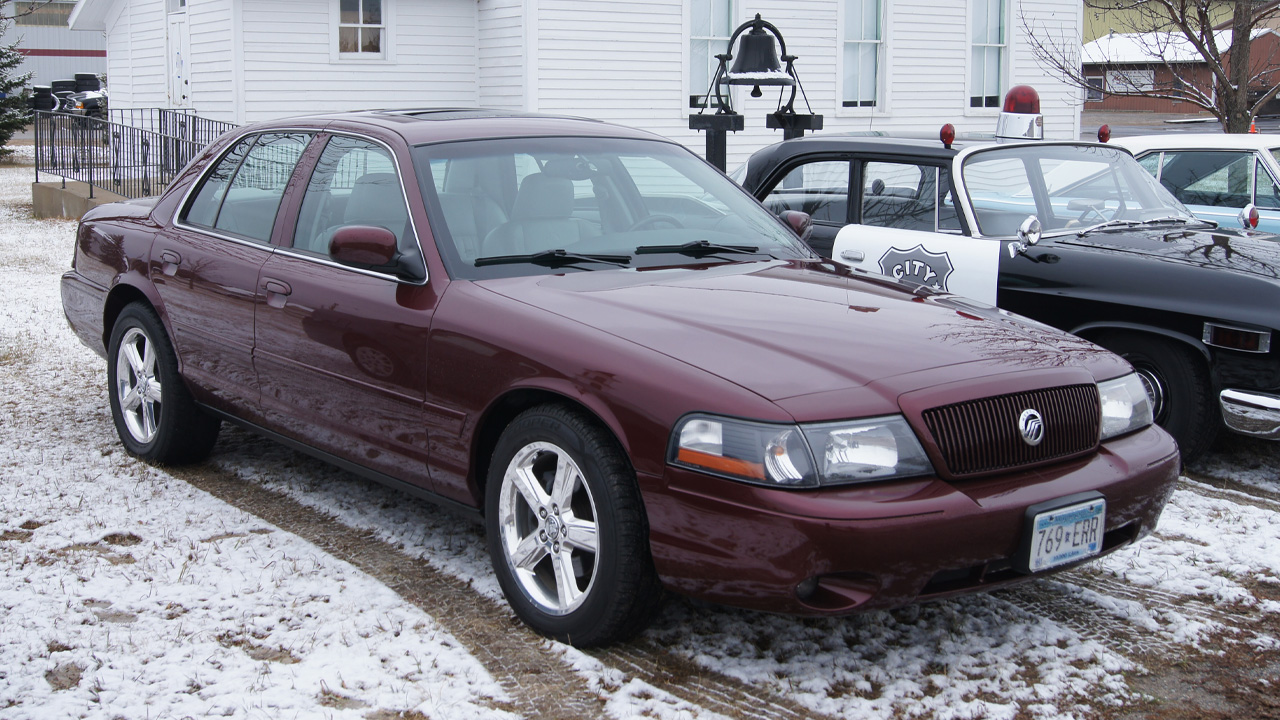 Mercury Marauder, front 3/4 view, snowy driveway, burgundy exterior