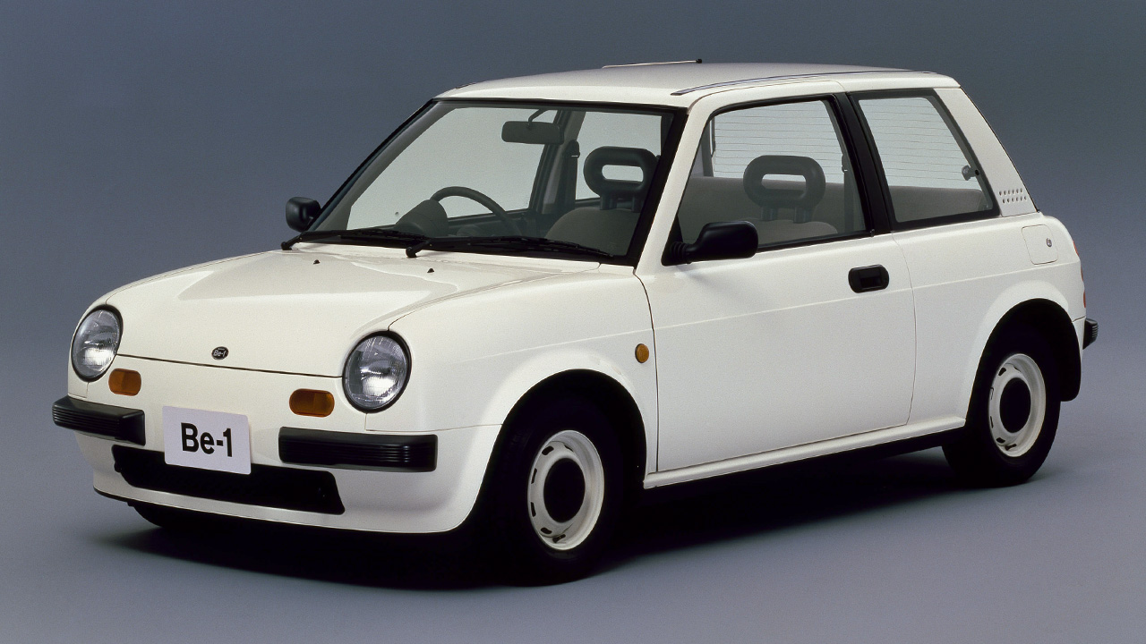 The Nissan Be-1 in white, front 3/4 view, studio shot