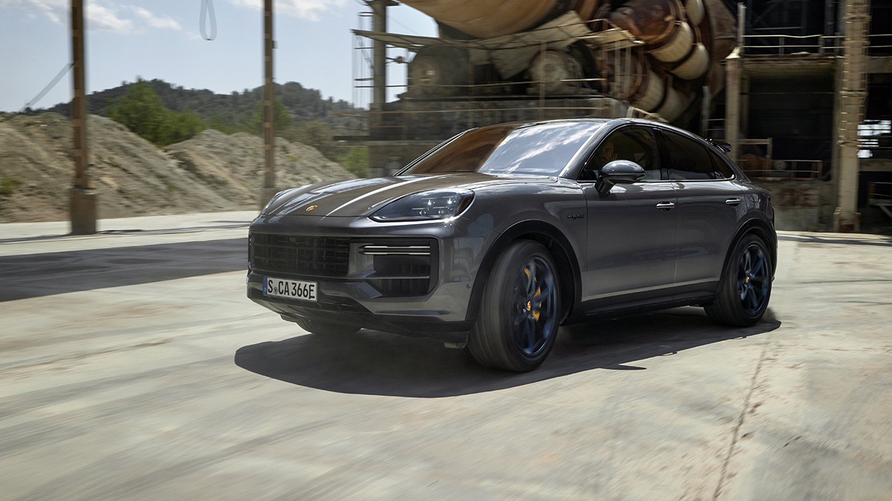 Porsche Cayenne e-Hybrid with Turbo GT Package, gray, front 3/4 view, cornering