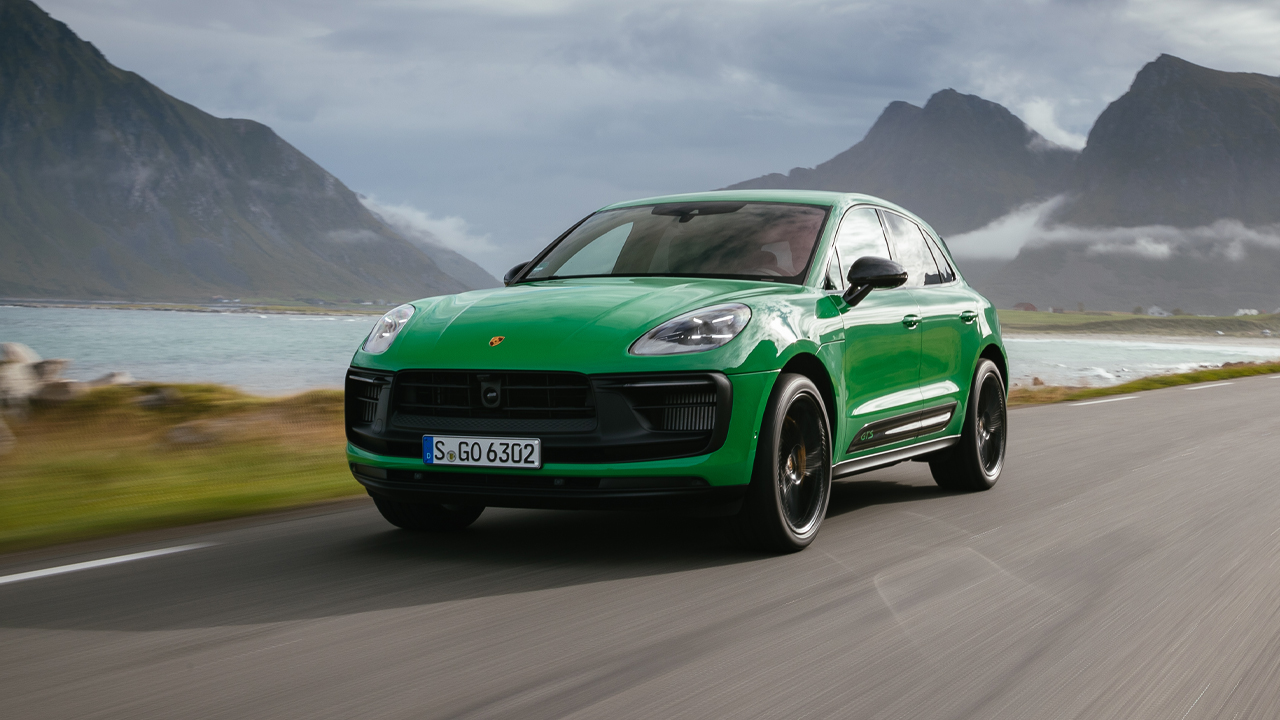 Porsche Macan GTS, front 3/4 view, green, driving, mountainous area