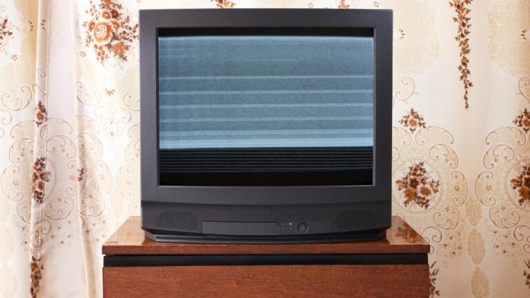 Old TV with clutter on screen, vintage design in 80s and 90s style.