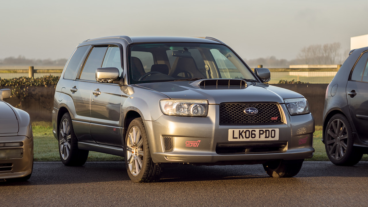Subaru Forester STI, front 3/4 view, silver, test track, UK plates.