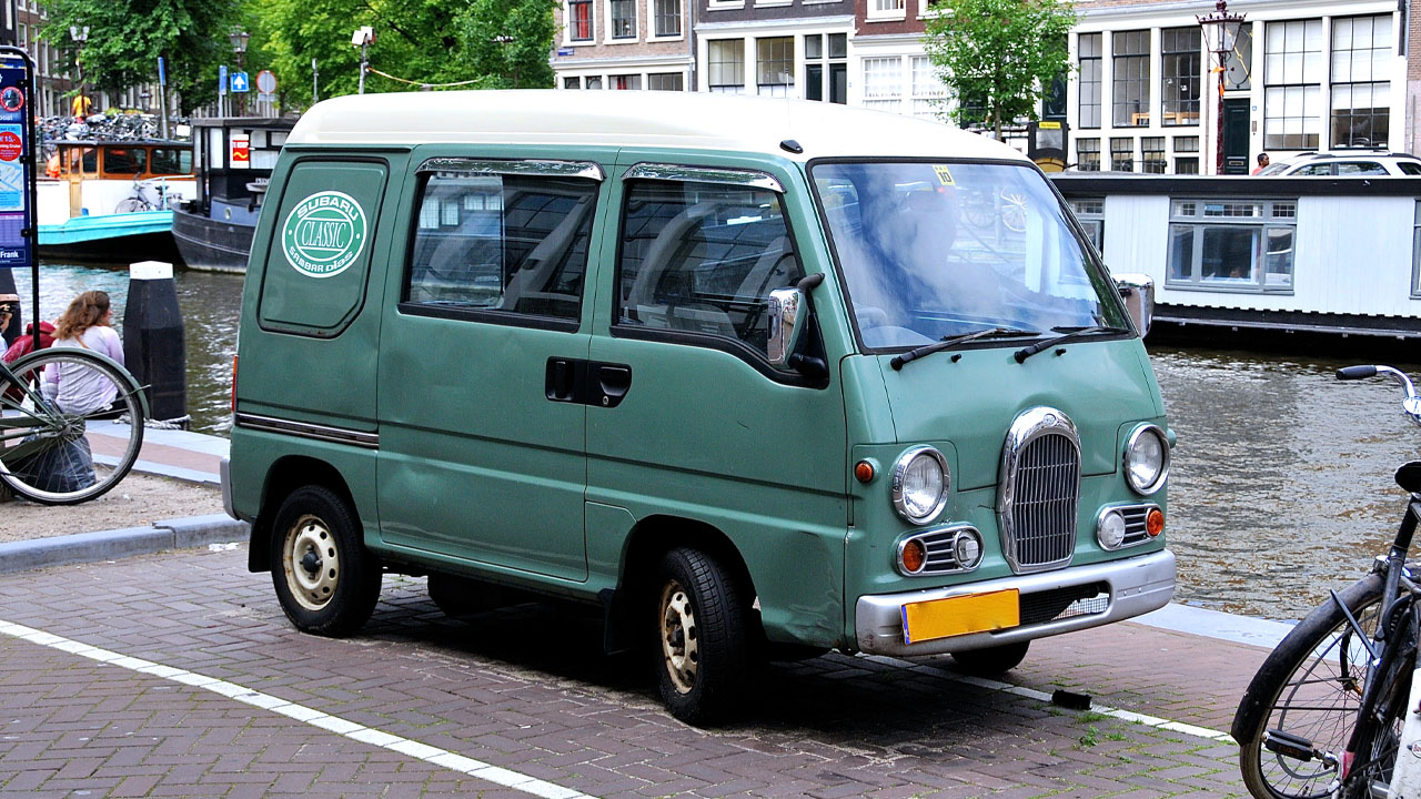 Subaru Sambar, front 3/4 view, canal, teal exterior, white roof, retro body kit
