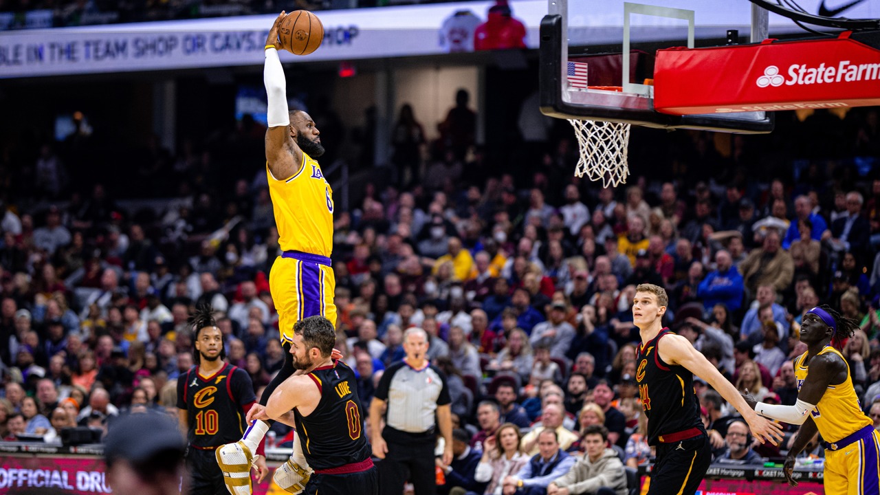 Lebron James dunking in a game.