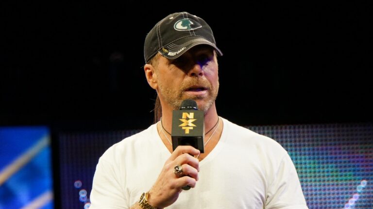 Shawn Michaels speaking at an event.