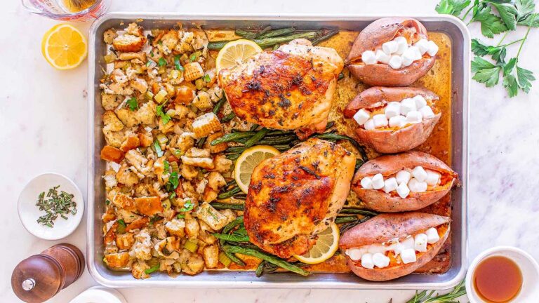A Thanksgiving sheet pan recipe featuring roasted chicken, potatoes, and stuffing.