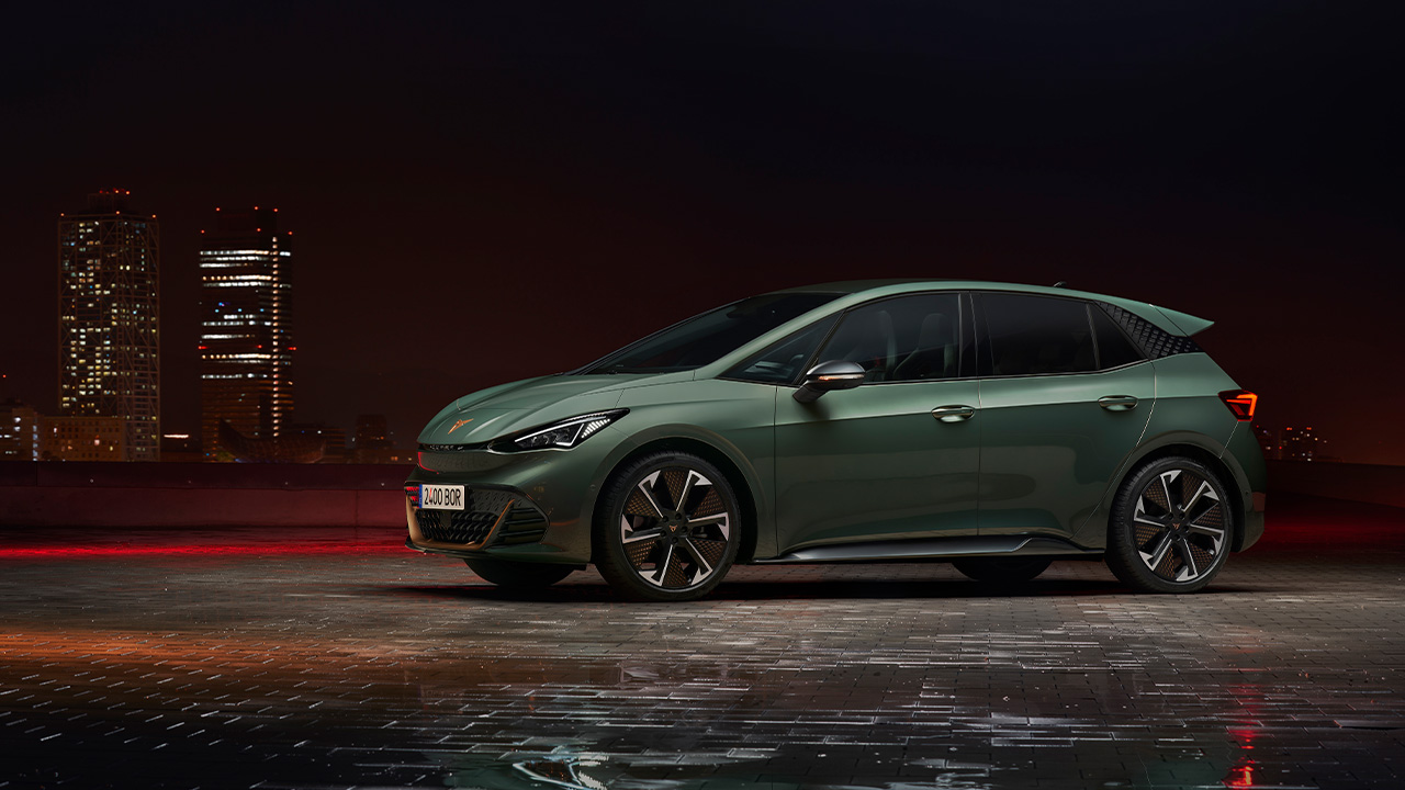 Cupra Born VZ, front 3/4 view, nighttime, green exterior