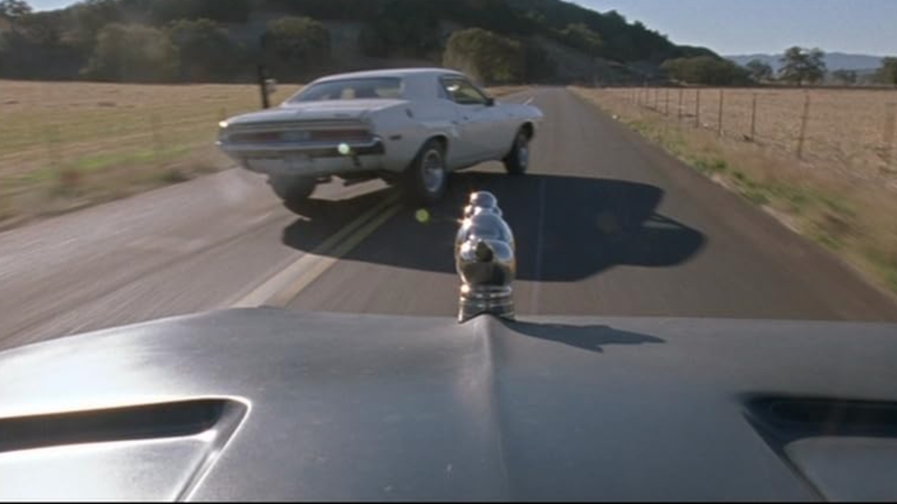 White Dodge Challenger Death Proof.