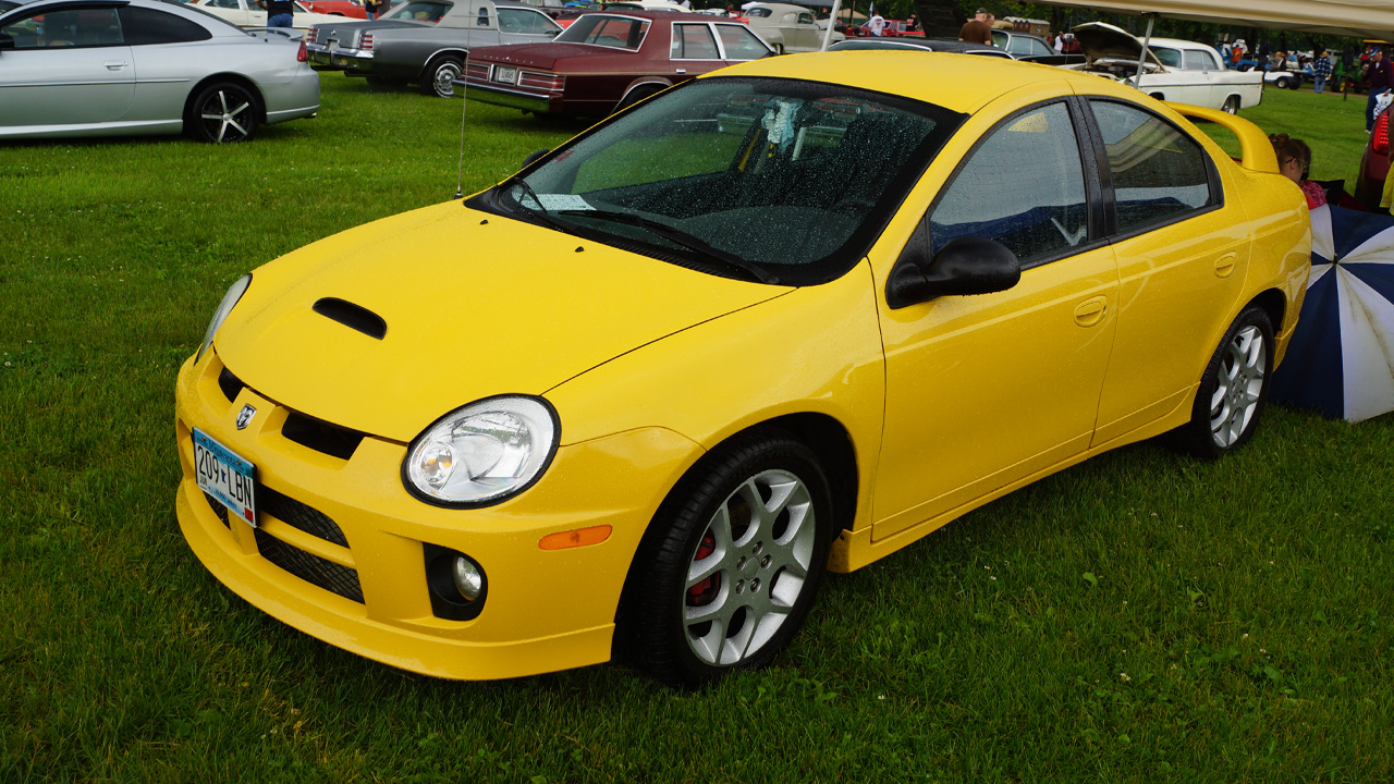 Dodge Neon SRT-4, front 3/4 view, yellow exterior, open air car show