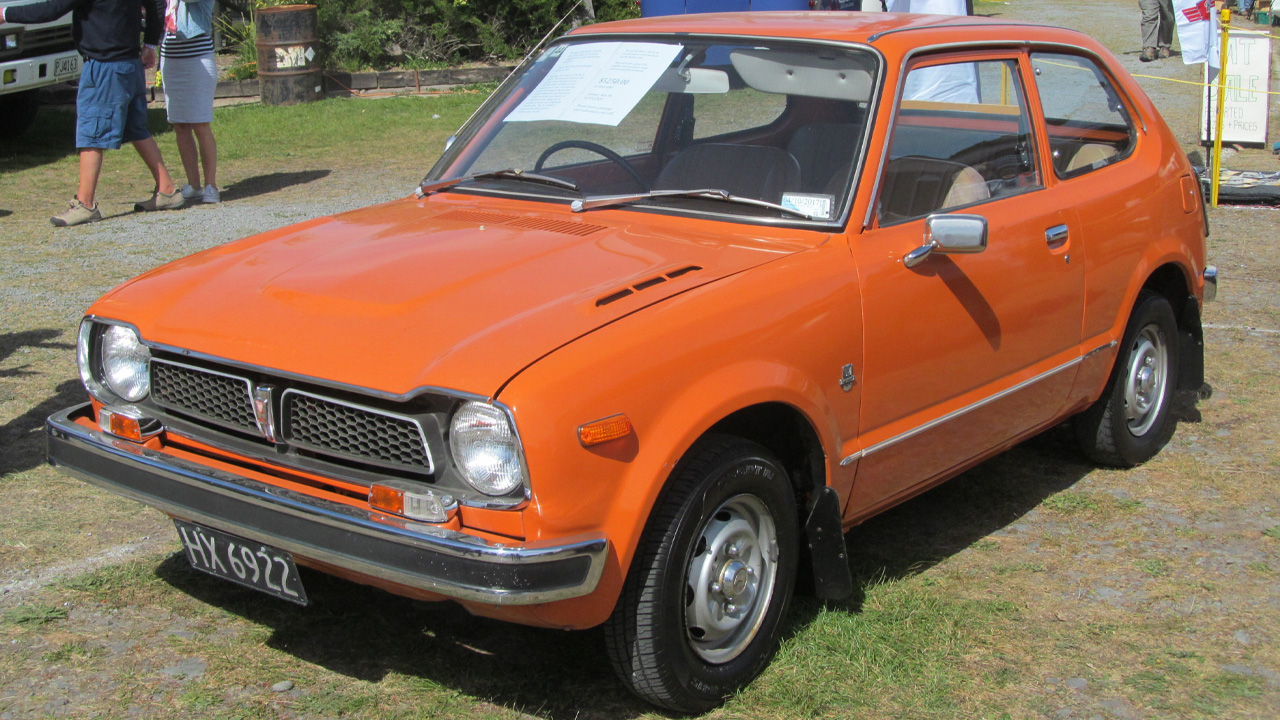 First generation Honda Civic, front 3/4 view, orange exterior