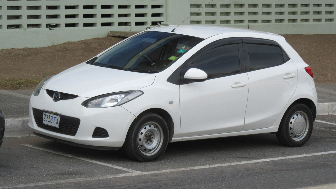 Mazda 2, front 3/4 view, white exterior, steel wheels